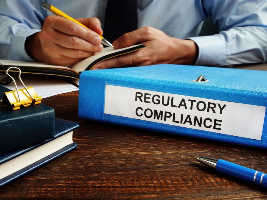 Regulatory compliance papers in the folder and manager