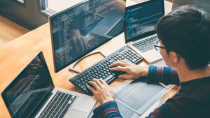 web dev software developer working on computer