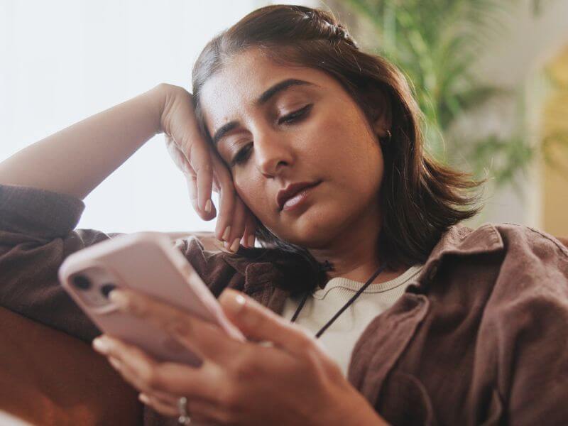 a woman looking at her phone