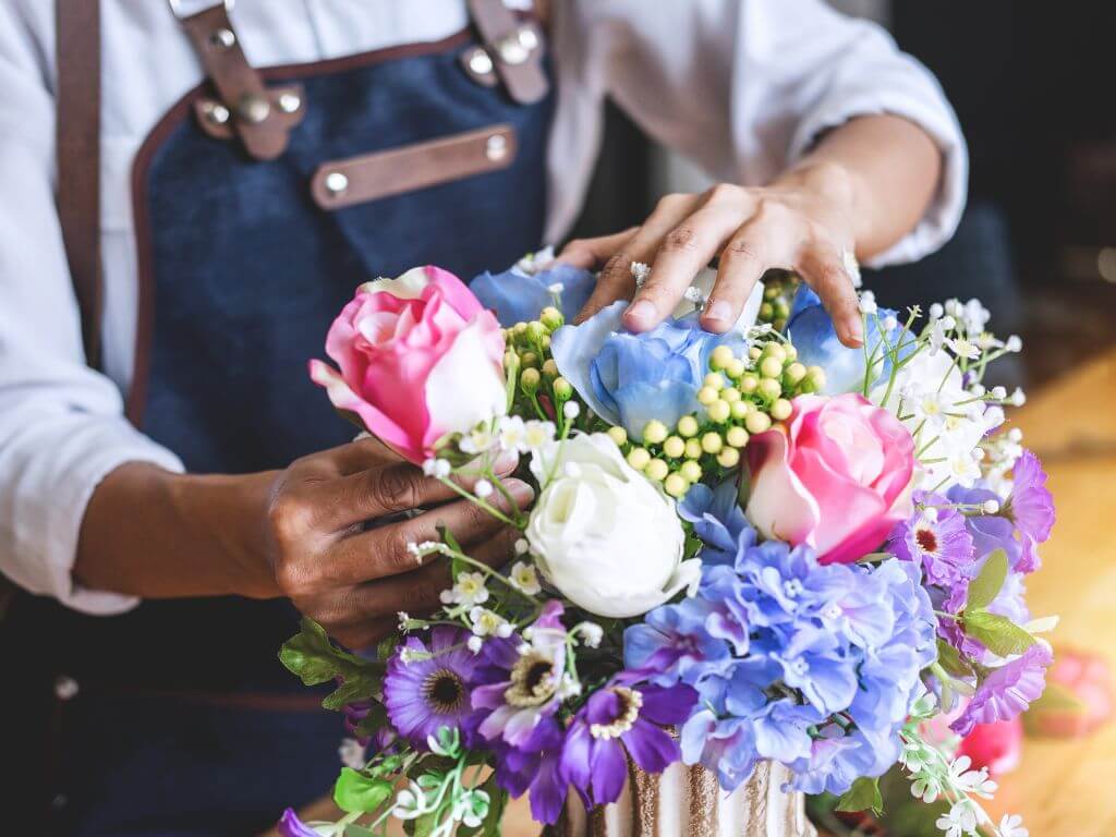 a florist arranging flower decoration