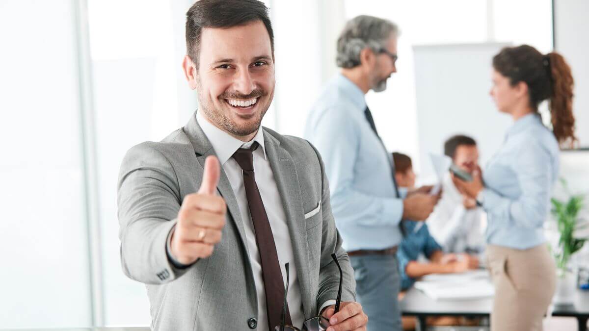 a business man giving a thumbs up