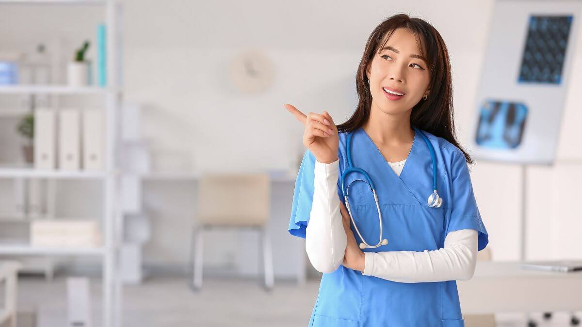 a cheerful doctor posing in her office
