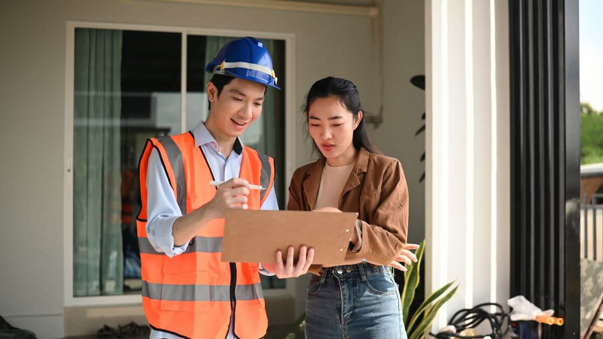 a contractor debriefing a homeowner on renovation progress