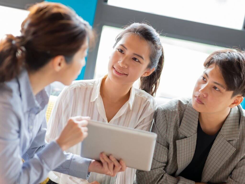 a couple having a consultation session with their lawyer
