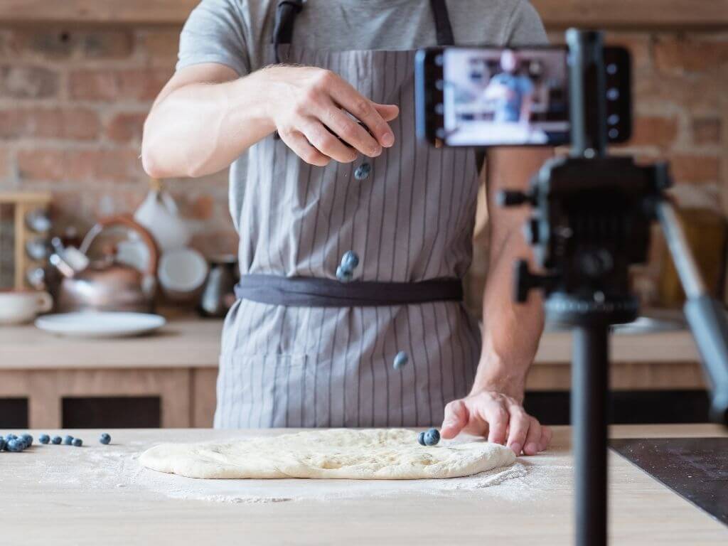 a person recording a bakery vlog