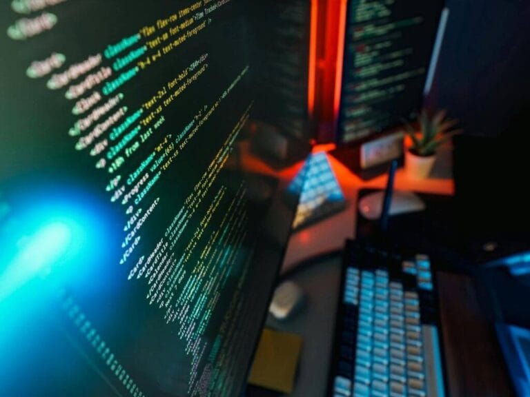 a workstation with codes shown on the monitor screen